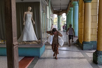 Work: Steve McCurry Woman Walks by Wedding Dress