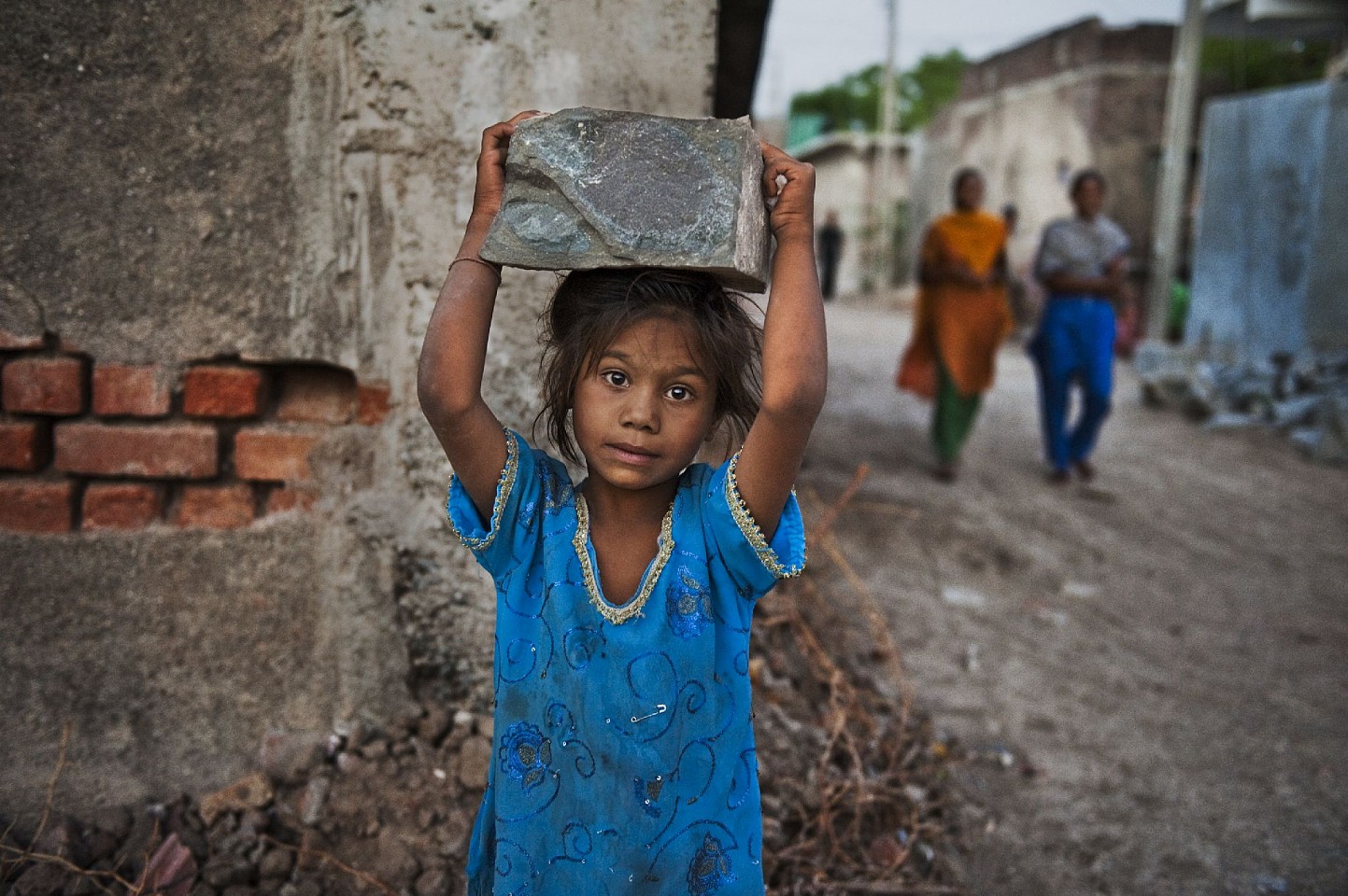 Steve McCurry, Girl Carries Rock, 2008
FujiFlex Crystal Archive Print
Price/Size on request